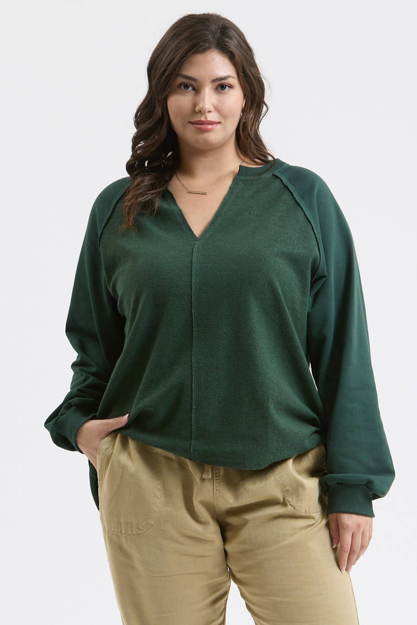 EXPOSED SEAM RELAXED LONG SLEEVE KNIT TOP