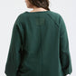 EXPOSED SEAM RELAXED LONG SLEEVE KNIT TOP